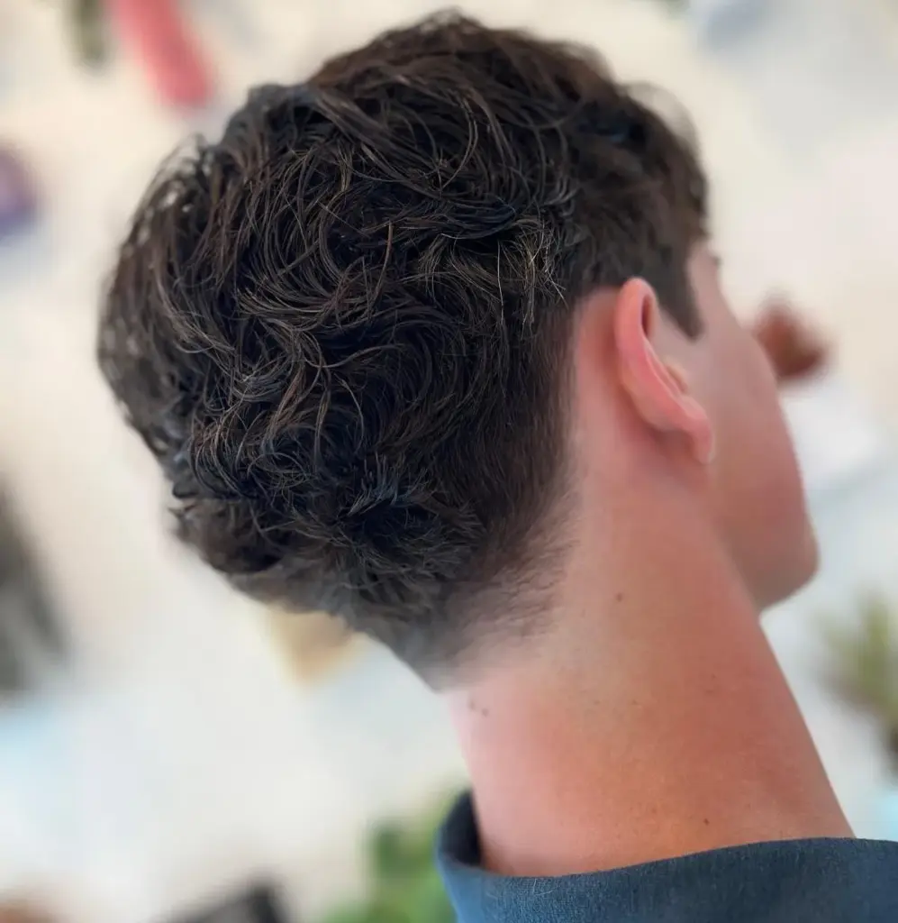 A short textured men's cut with a tapered neckline