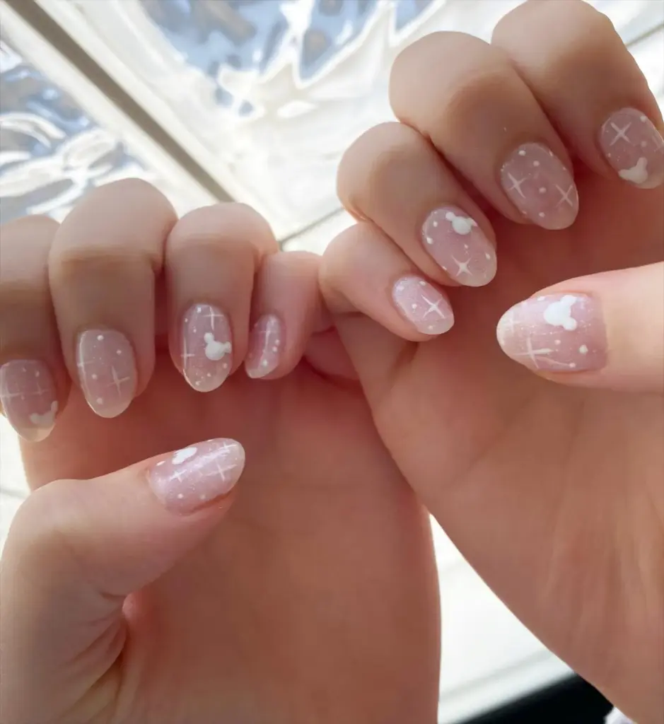 Short sheer pink nails with white hearts